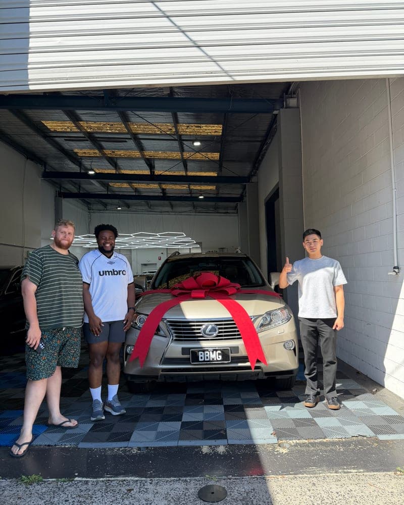 A customer picking up their car at Bayside Brothers Motors