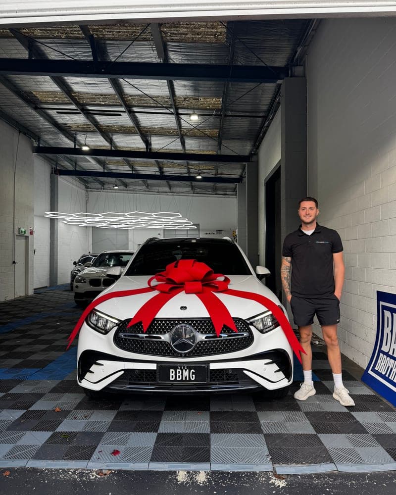 A customer picking up their car at Bayside Brothers Motors