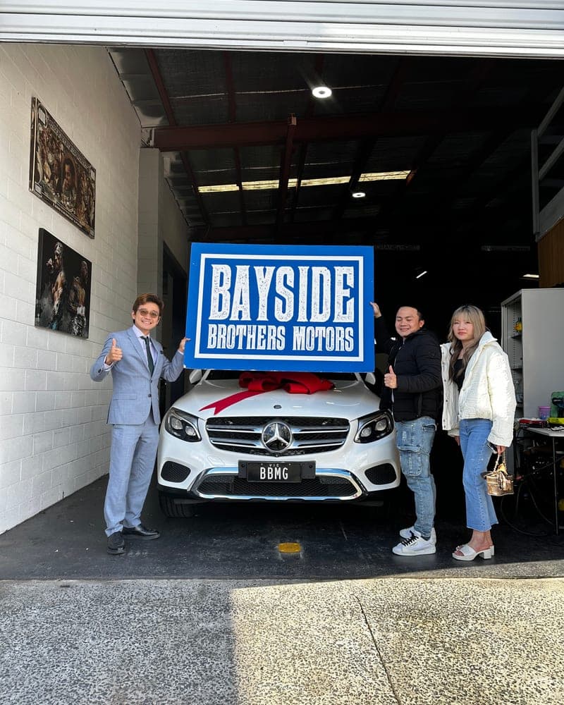 A customer picking up their car at Bayside Brothers Motors