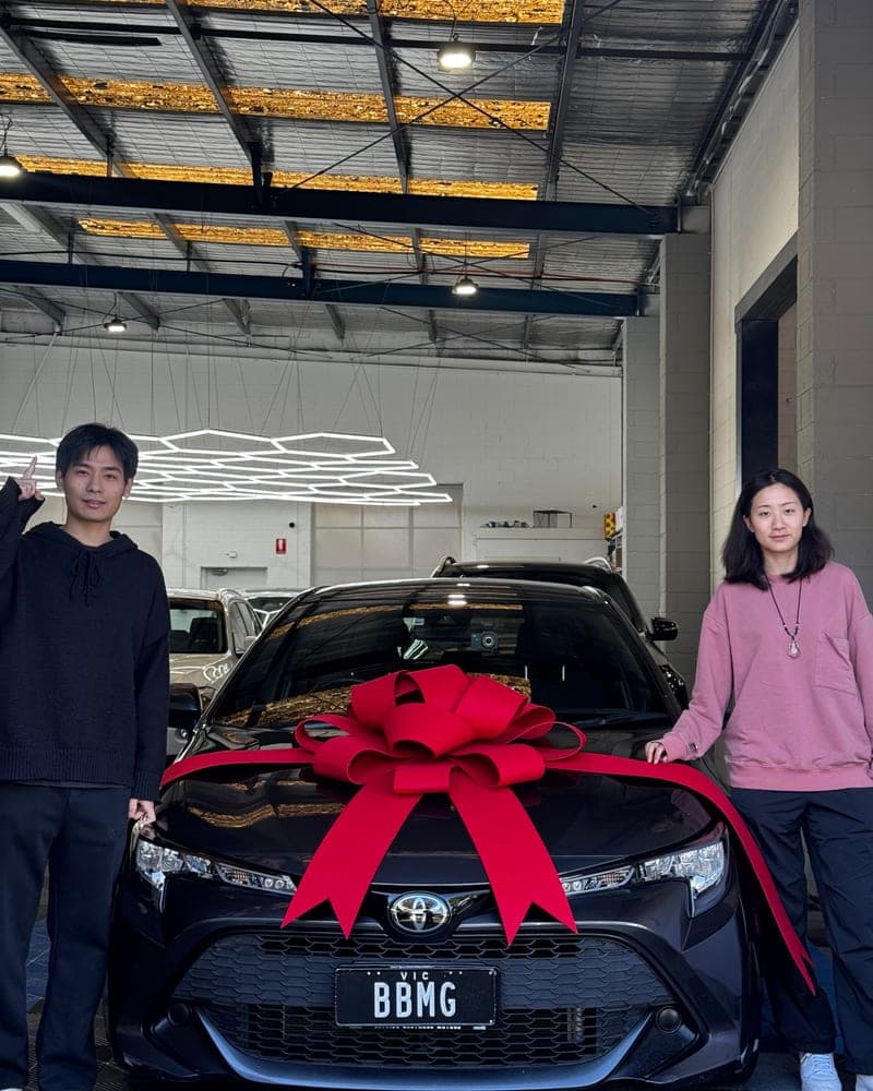A customer picking up their car at Bayside Brothers Motors