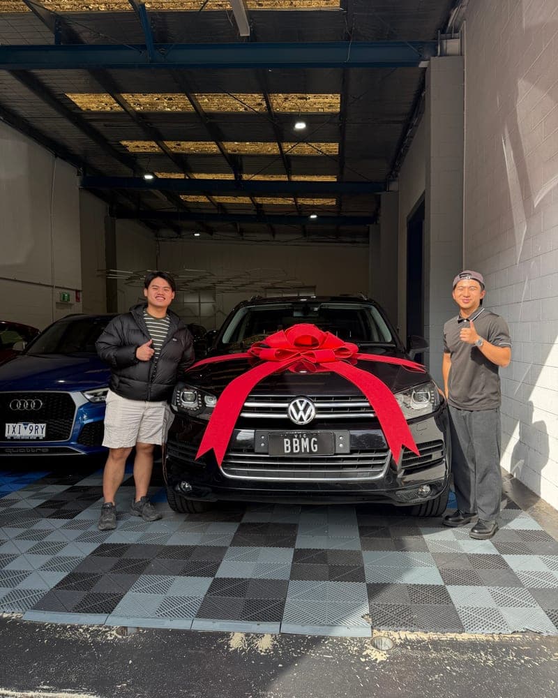 A customer picking up their car at Bayside Brothers Motors