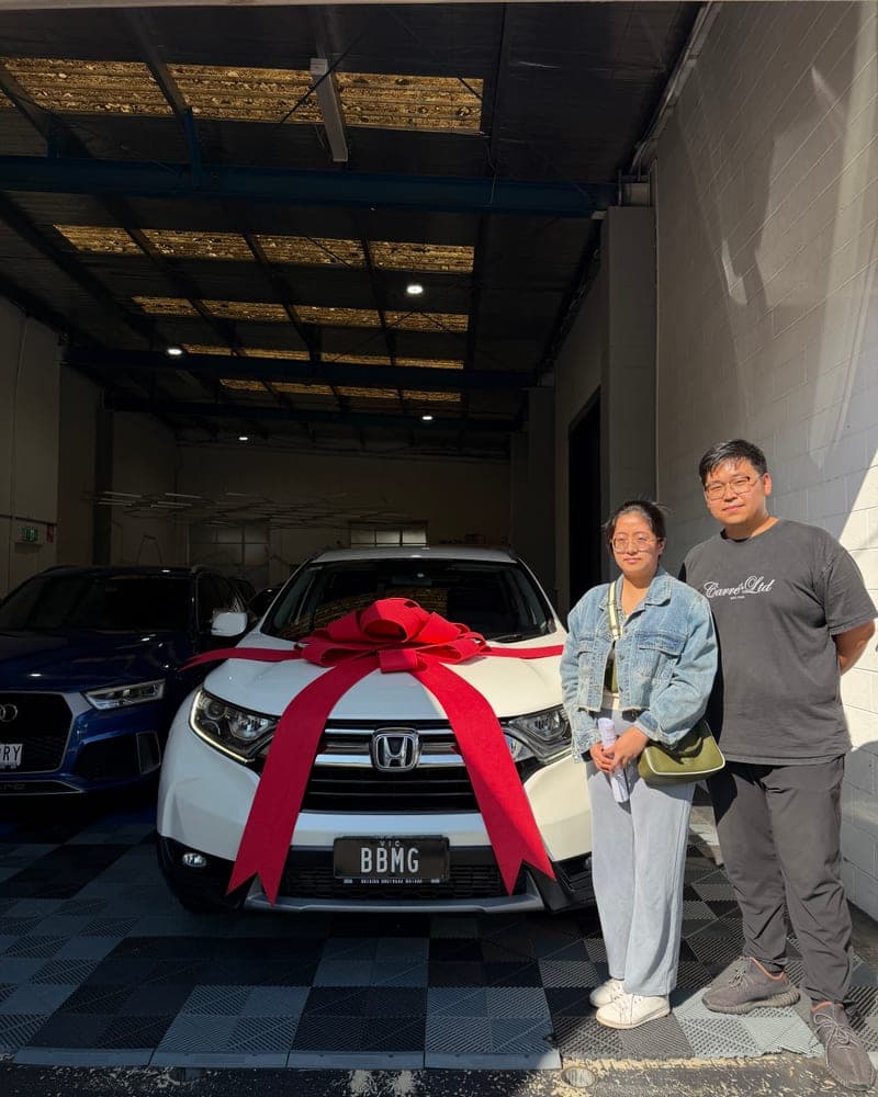 A customer picking up their car at Bayside Brothers Motors
