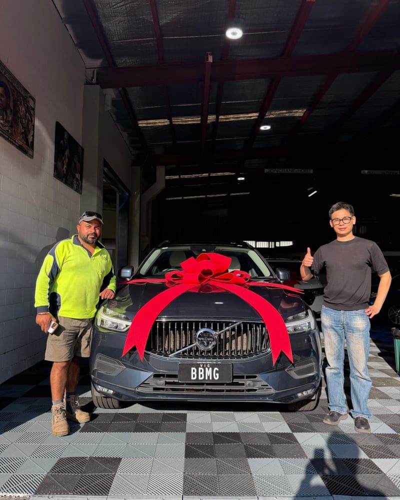 A customer picking up their car at Bayside Brothers Motors