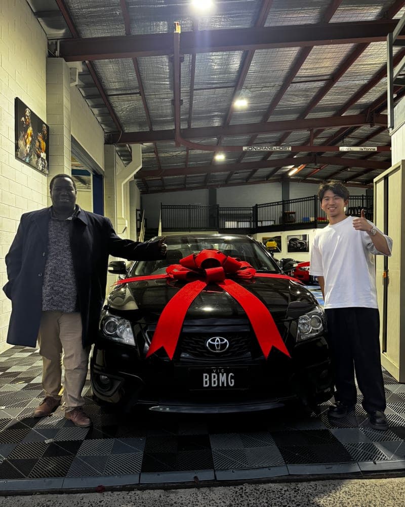 A customer picking up their car at Bayside Brothers Motors