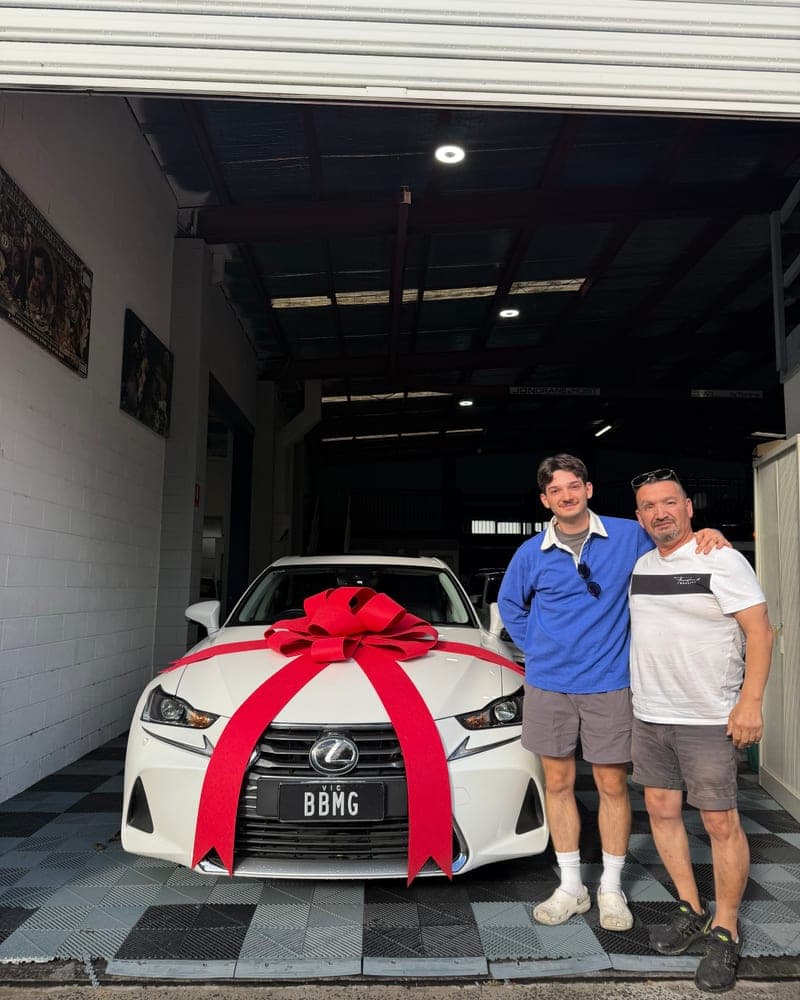 A customer picking up their car at Bayside Brothers Motors