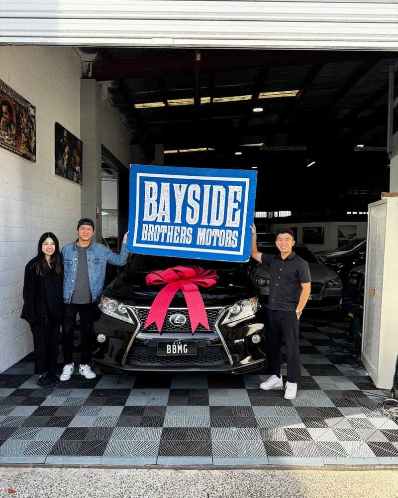 A customer picking up their car at Bayside Brothers Motors