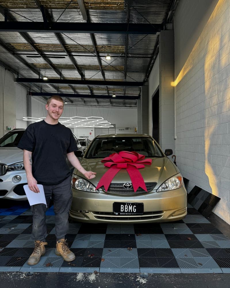 A customer picking up their car at Bayside Brothers Motors