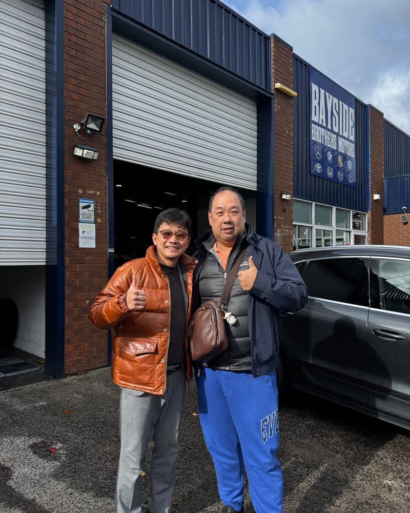 A customer picking up their car at Bayside Brothers Motors