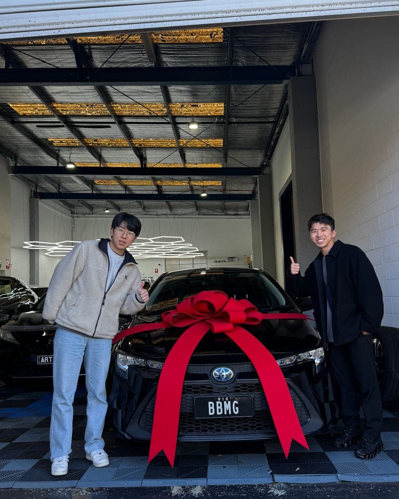 A customer picking up their car at Bayside Brothers Motors