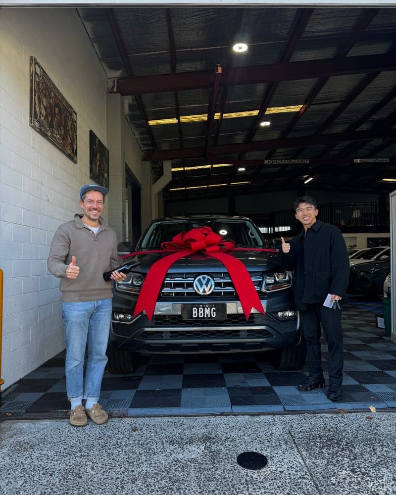 A customer picking up their car at Bayside Brothers Motors