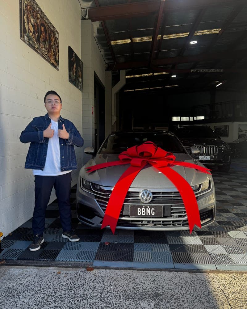 A customer picking up their car at Bayside Brothers Motors