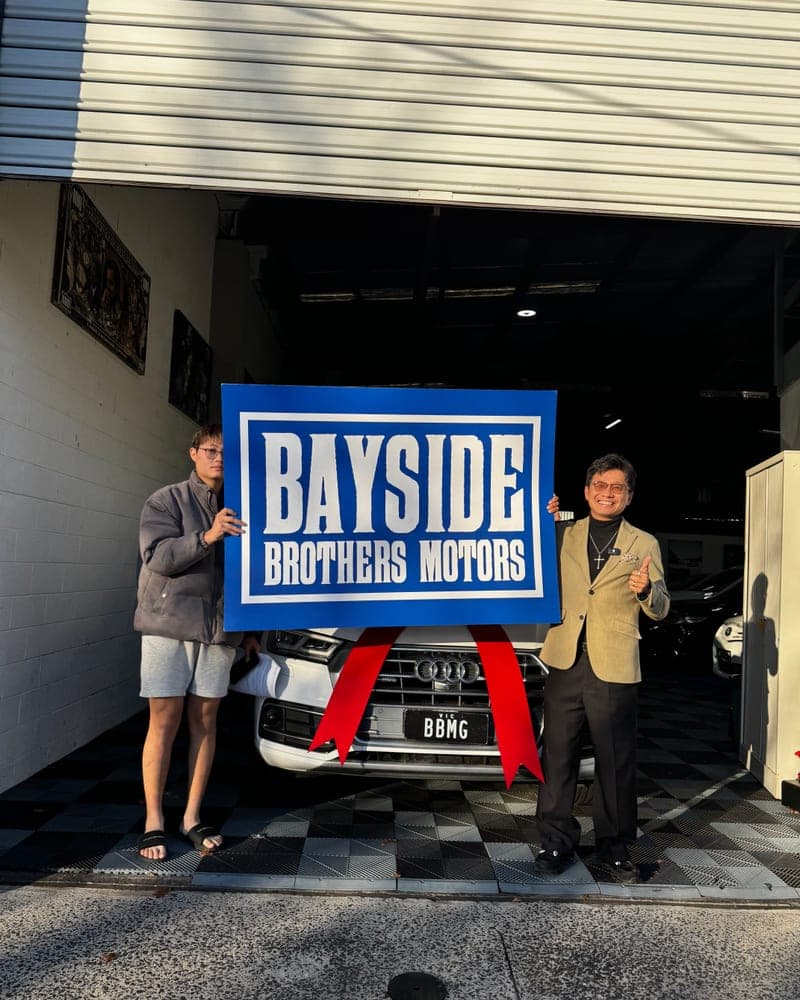 A customer picking up their car at Bayside Brothers Motors