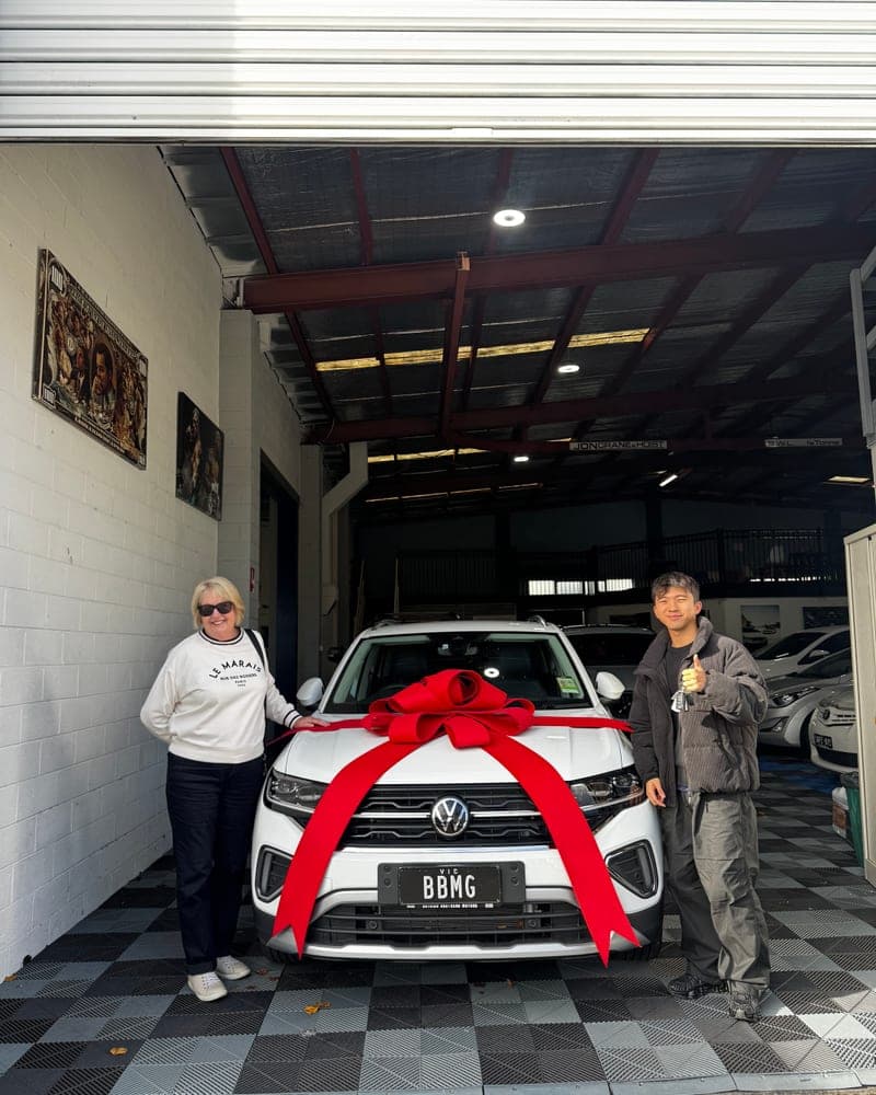 A customer picking up their car at Bayside Brothers Motors