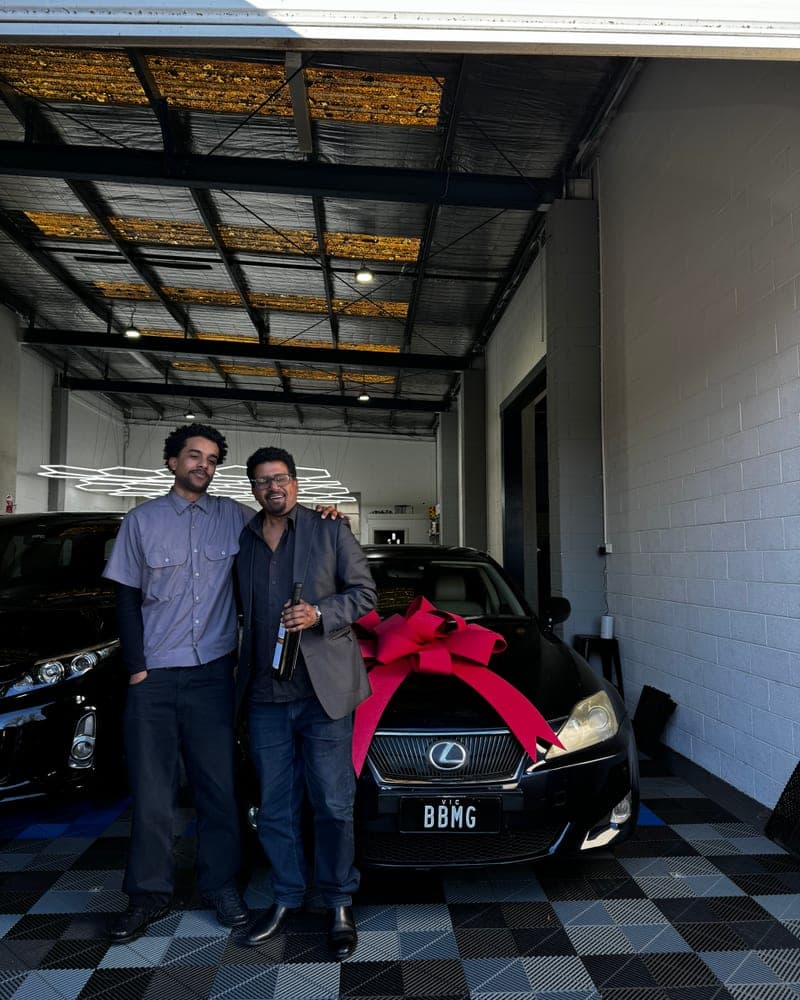 A customer picking up their car at Bayside Brothers Motors