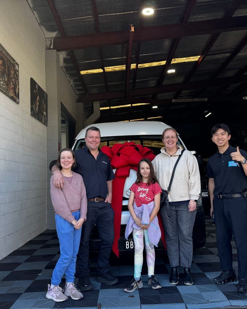 A customer picking up their car at Bayside Brothers Motors