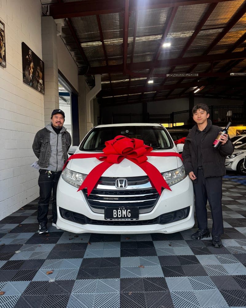 A customer picking up their car at Bayside Brothers Motors