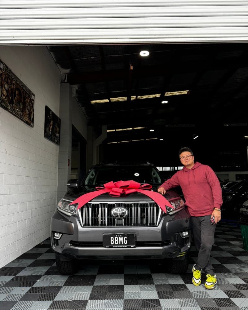 A customer picking up their car at Bayside Brothers Motors