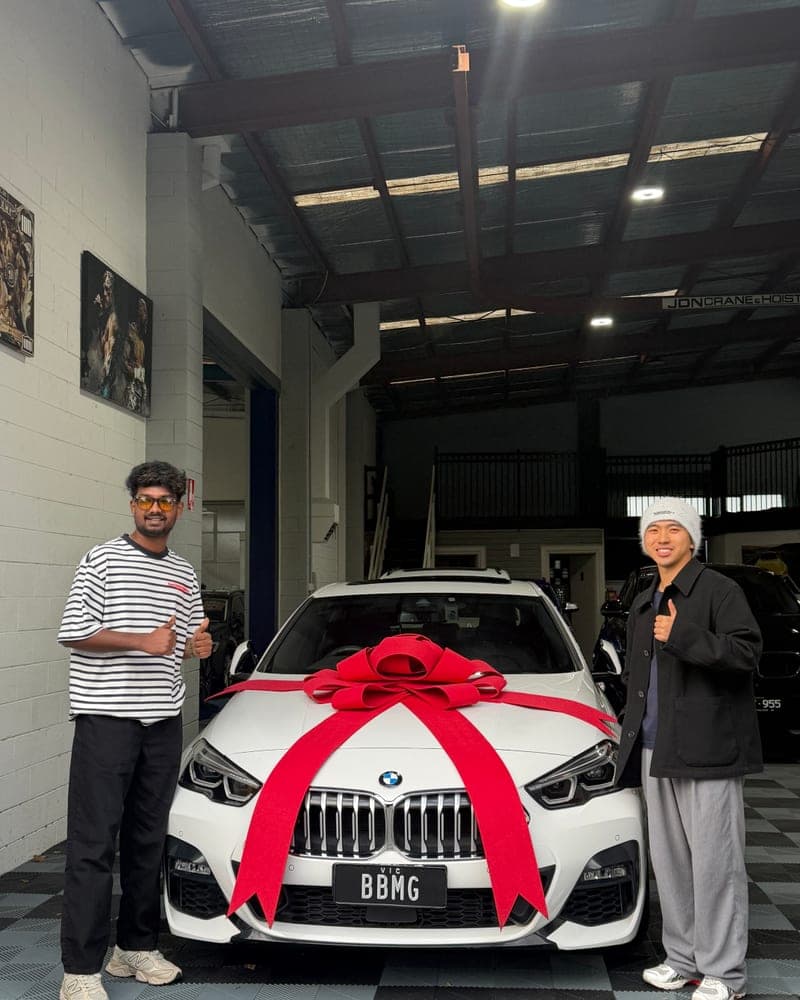 A customer picking up their car at Bayside Brothers Motors