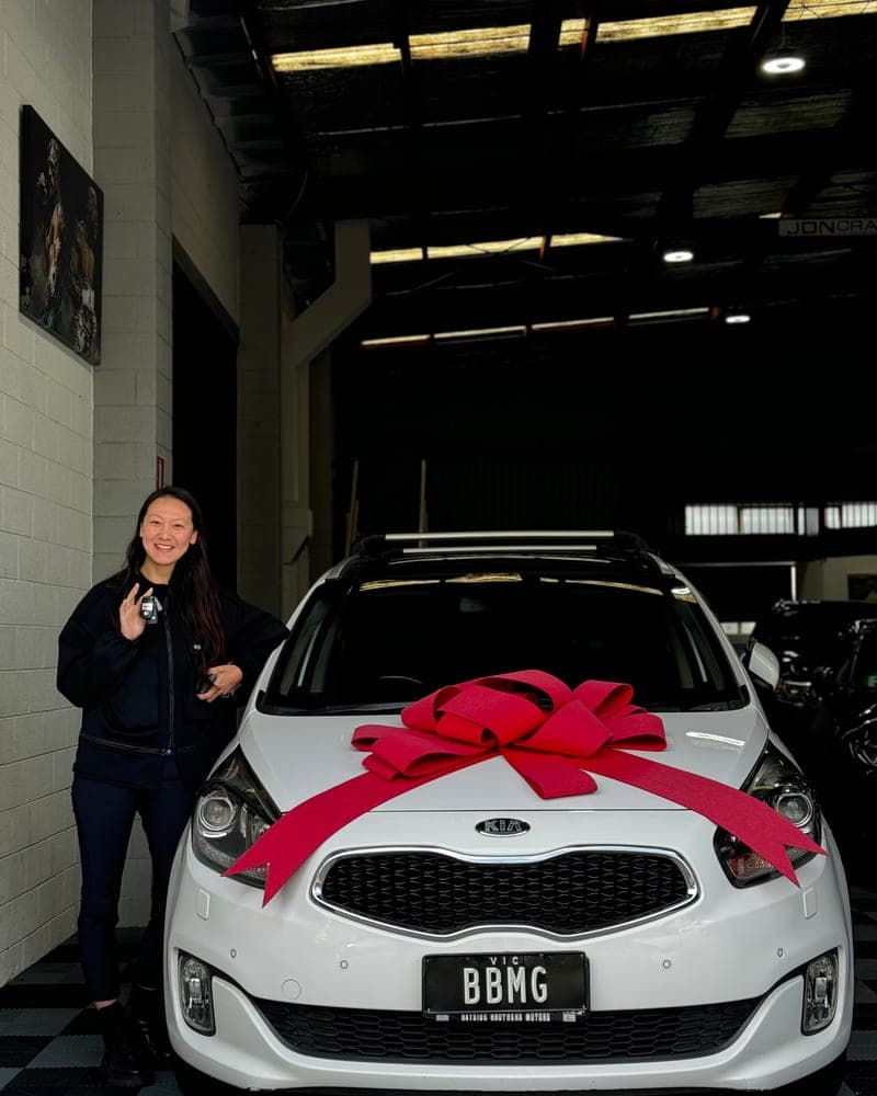A customer picking up their car at Bayside Brothers Motors