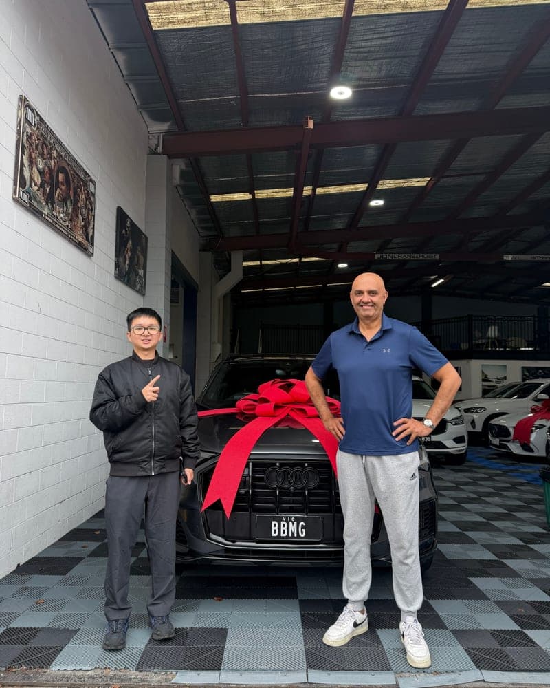 A customer picking up their car at Bayside Brothers Motors
