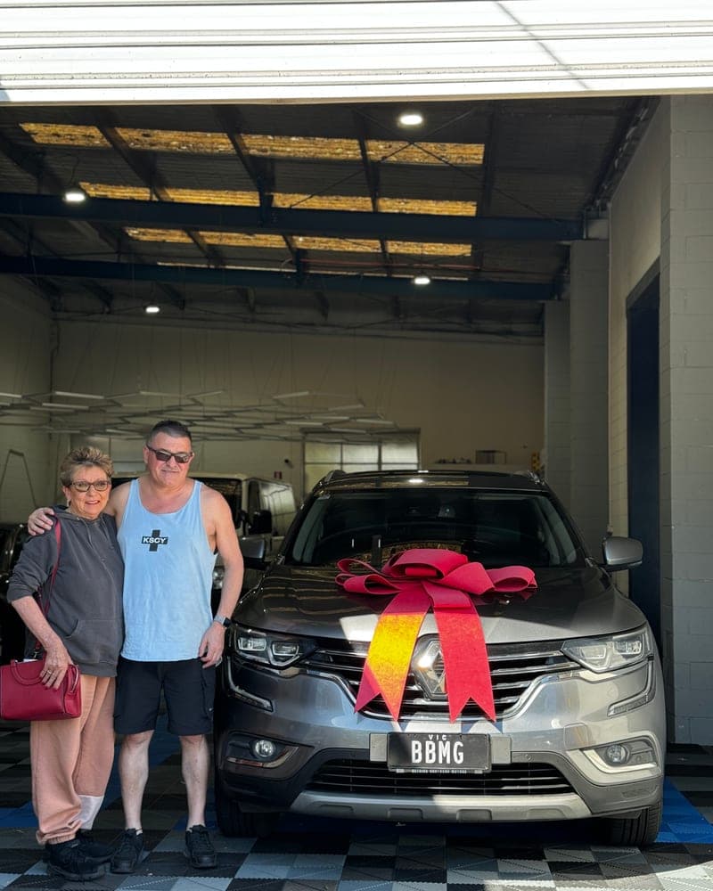 A customer picking up their car at Bayside Brothers Motors