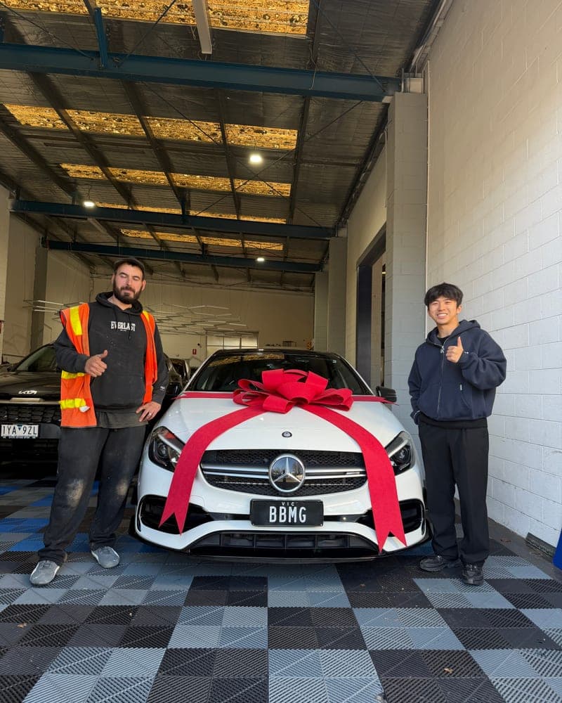 A customer picking up their car at Bayside Brothers Motors