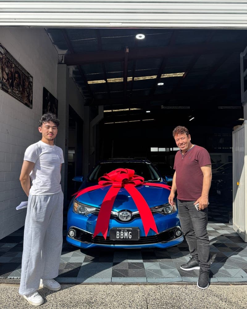 A customer picking up their car at Bayside Brothers Motors