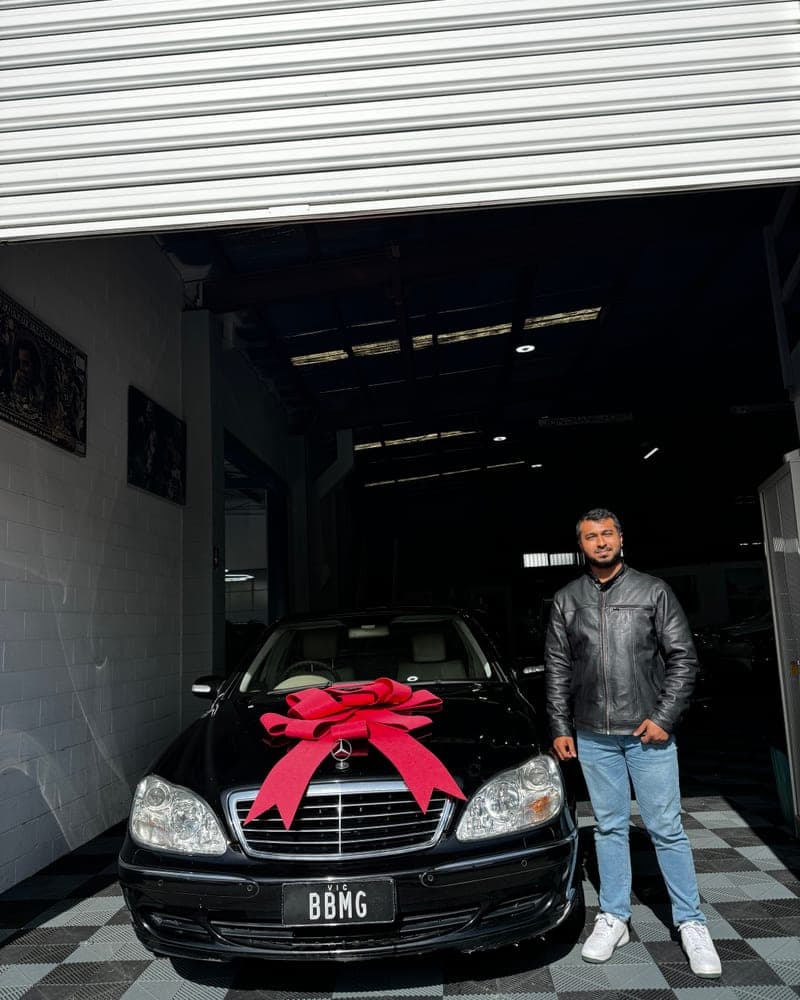A customer picking up their car at Bayside Brothers Motors