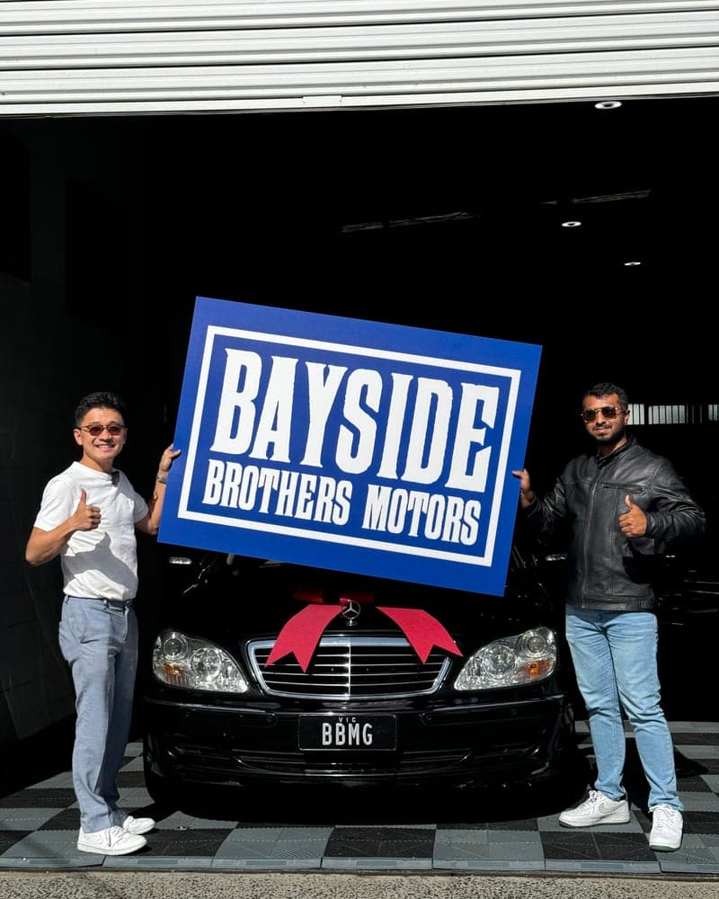 A customer picking up their car at Bayside Brothers Motors