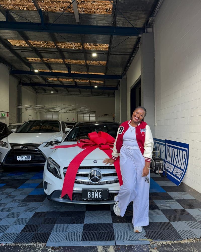 A customer picking up their car at Bayside Brothers Motors