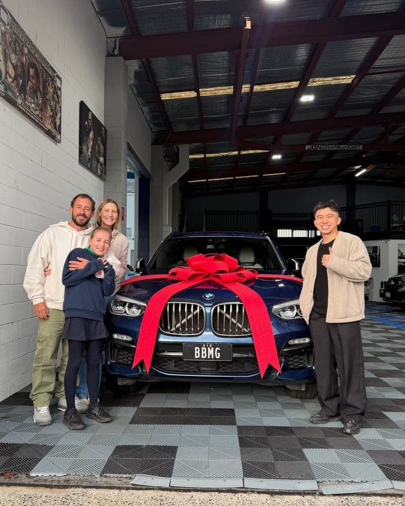 A customer picking up their car at Bayside Brothers Motors