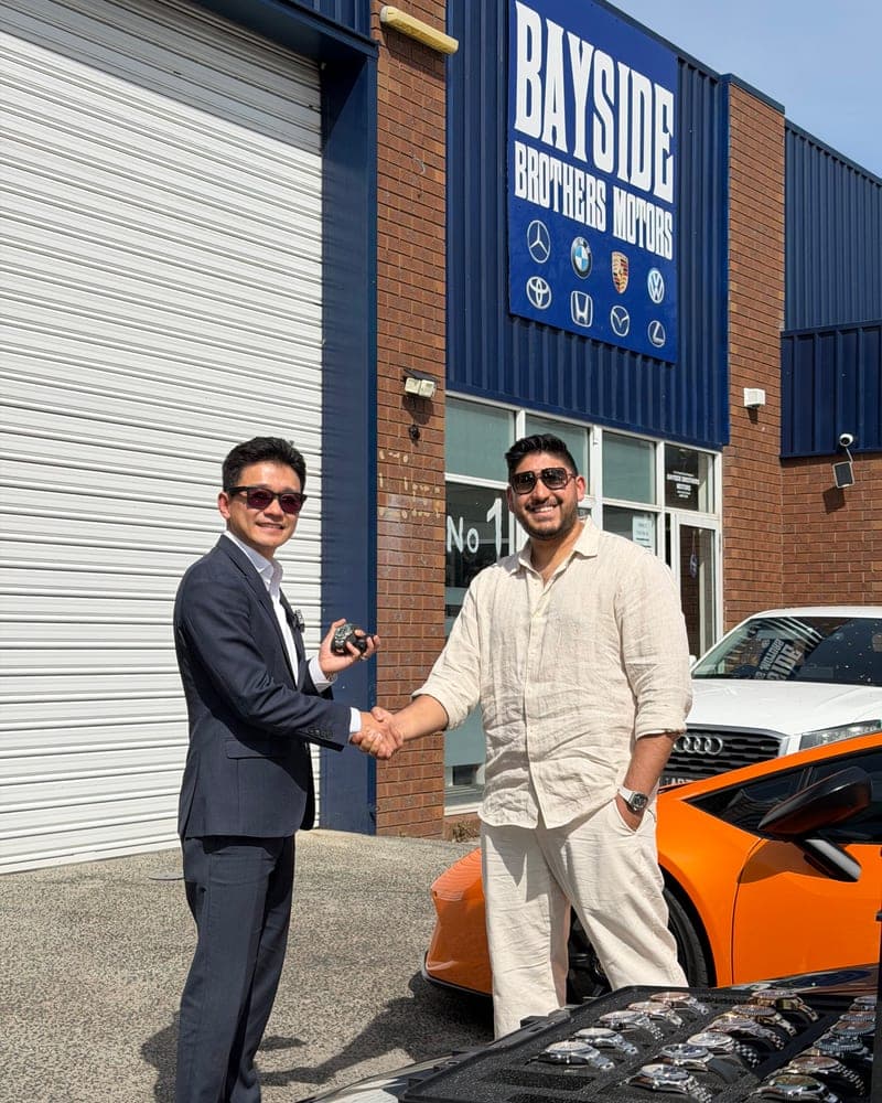 A customer picking up their car at Bayside Brothers Motors