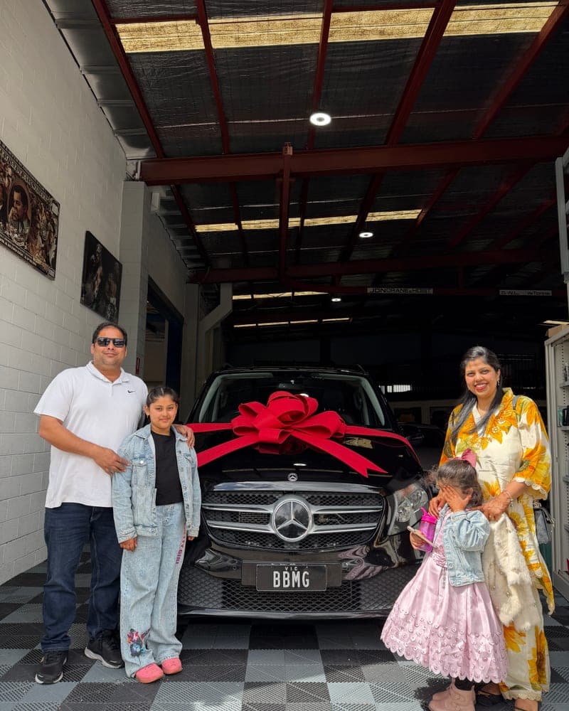 A customer picking up their car at Bayside Brothers Motors