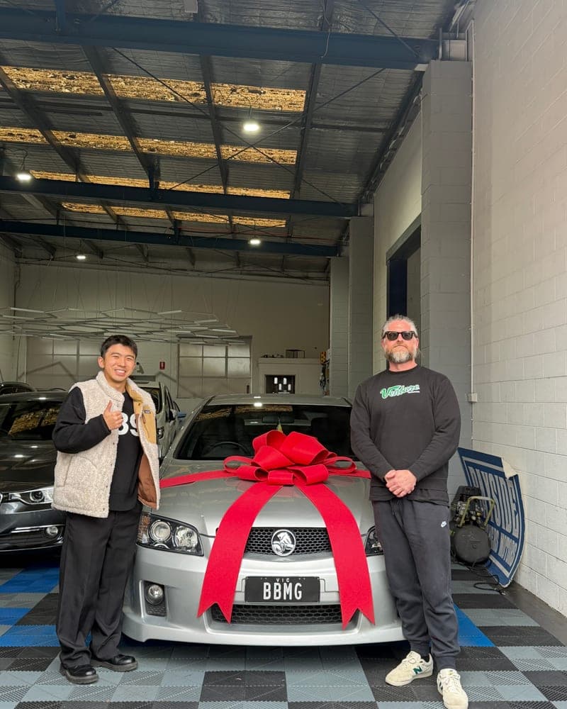 A customer picking up their car at Bayside Brothers Motors