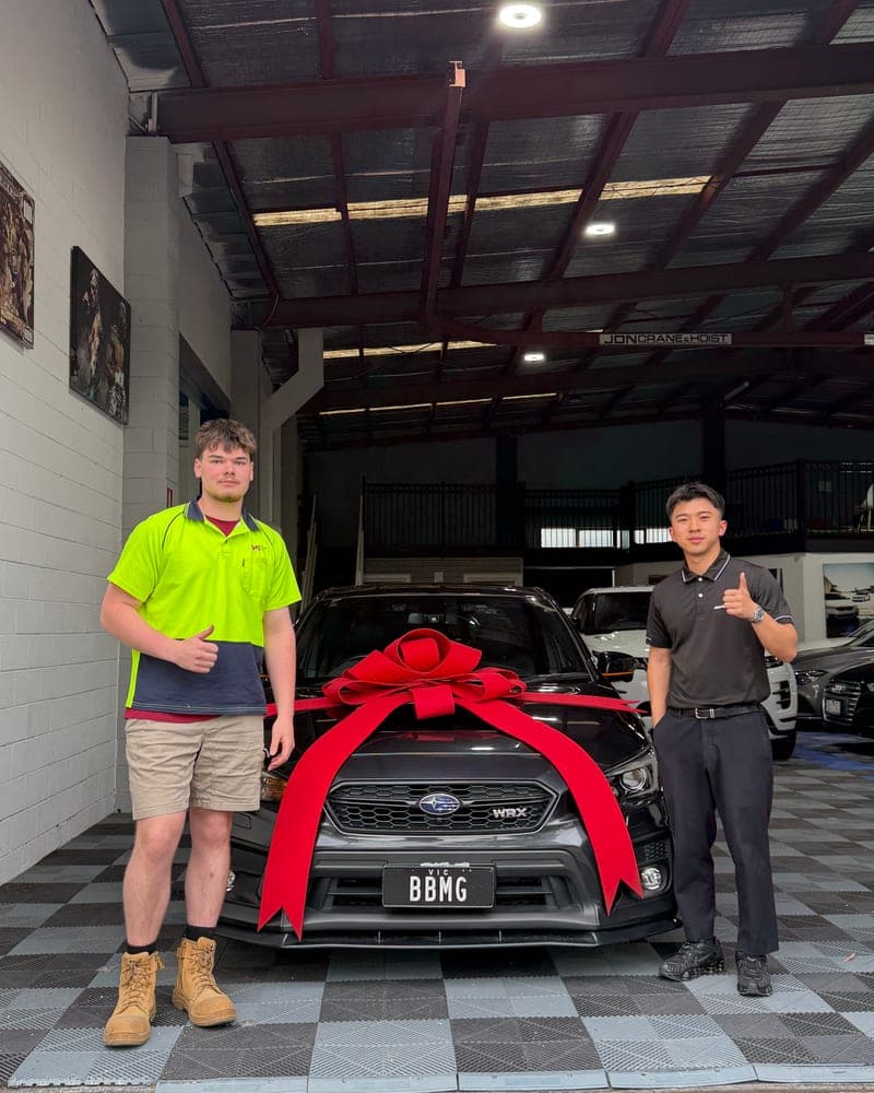 A customer picking up their car at Bayside Brothers Motors