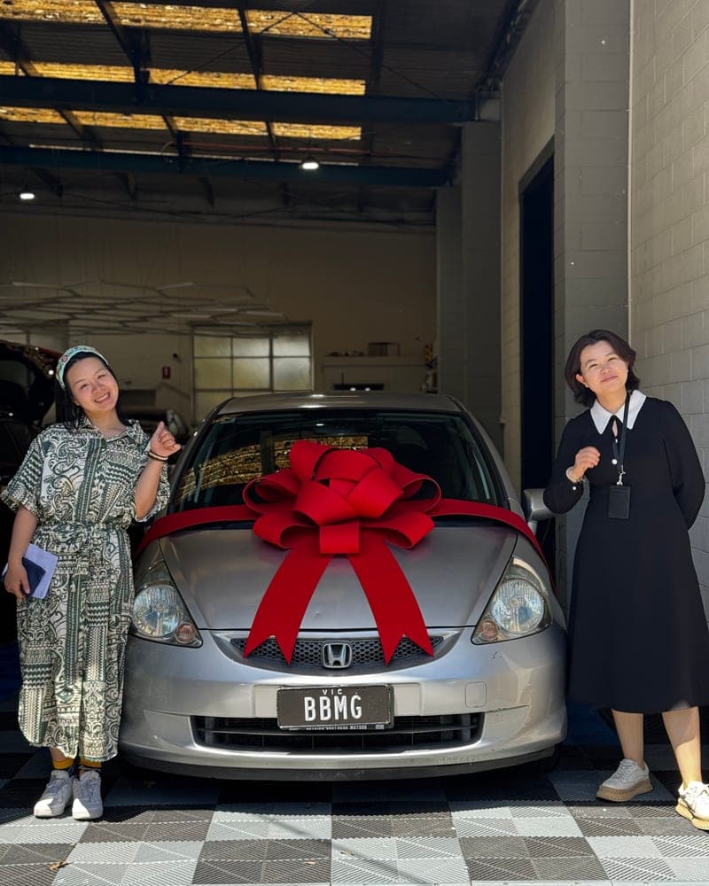 A customer picking up their car at Bayside Brothers Motors