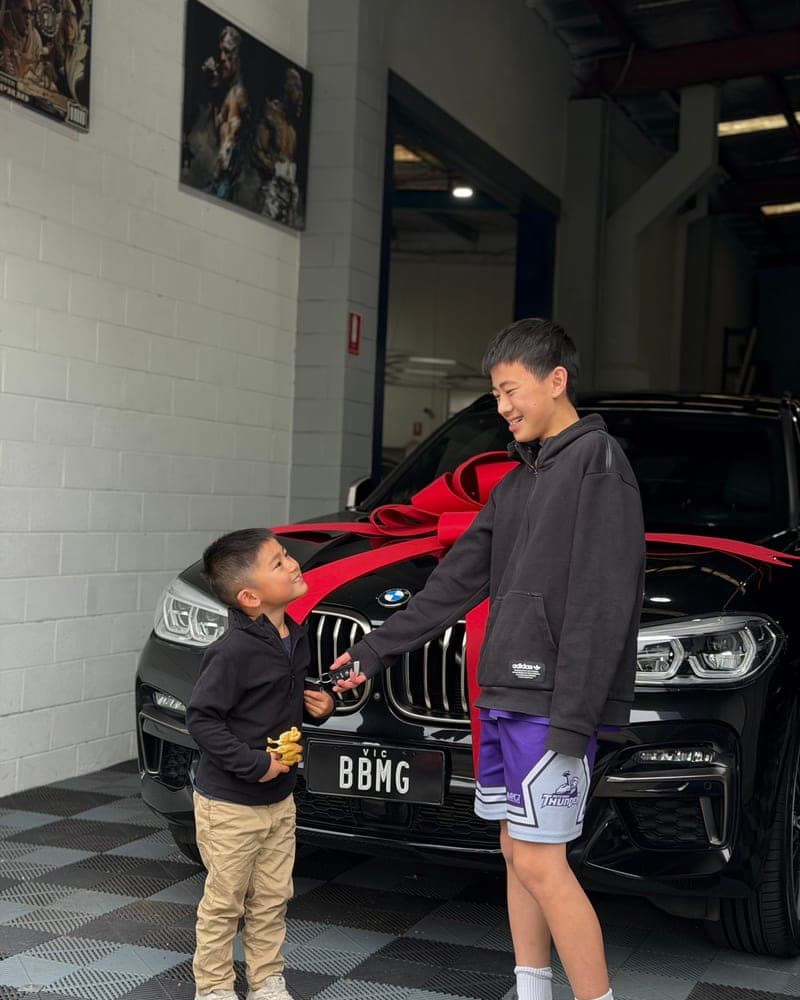 A customer picking up their car at Bayside Brothers Motors