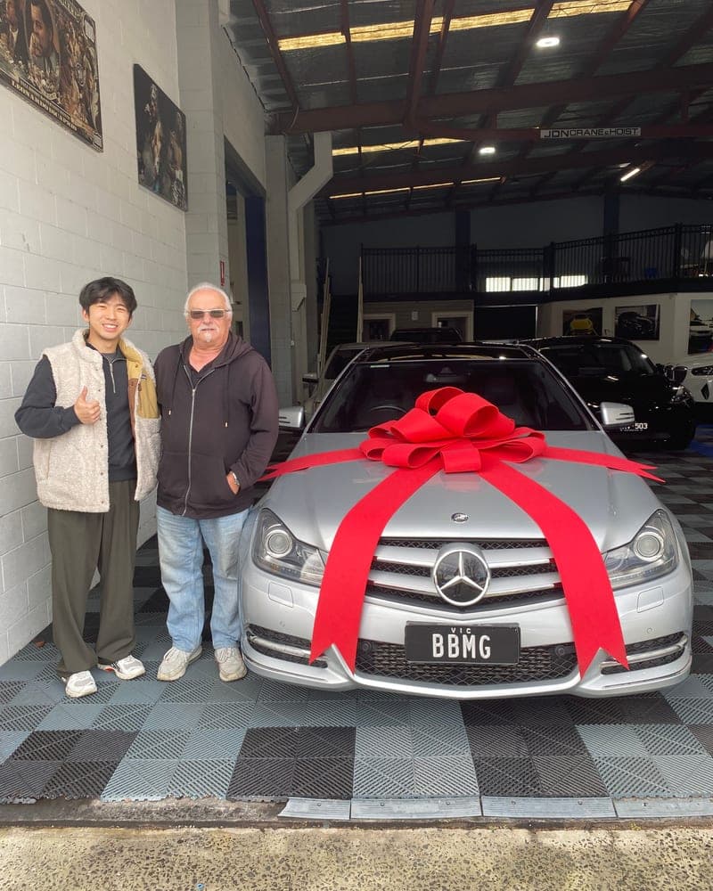 A customer picking up their car at Bayside Brothers Motors