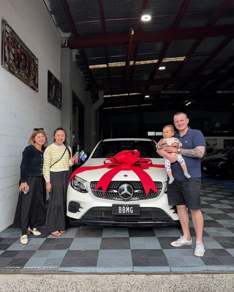 A customer picking up their car at Bayside Brothers Motors
