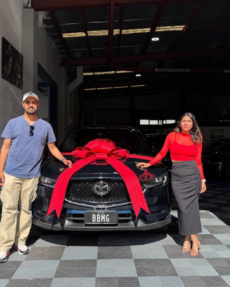 A customer picking up their car at Bayside Brothers Motors