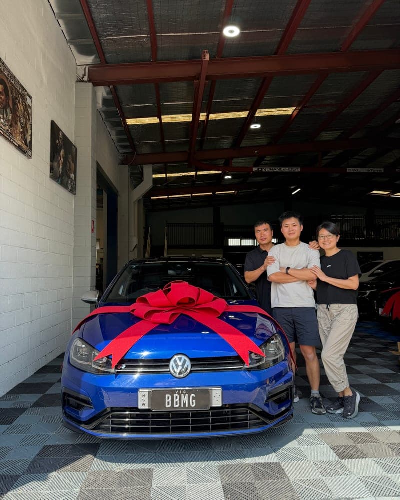 A customer picking up their car at Bayside Brothers Motors
