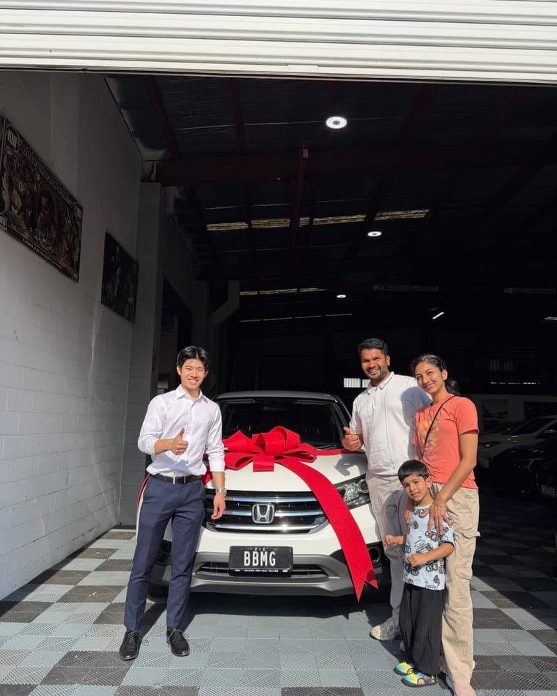 A customer picking up their car at Bayside Brothers Motors
