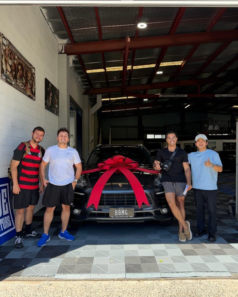 A customer picking up their car at Bayside Brothers Motors
