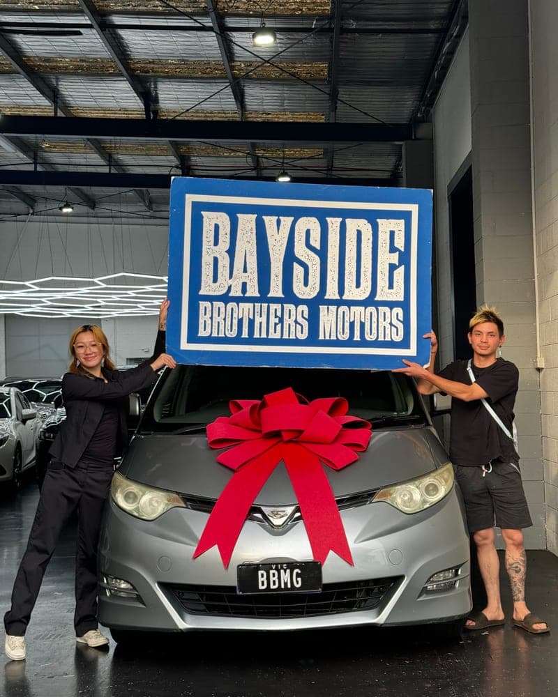 A customer picking up their car at Bayside Brothers Motors
