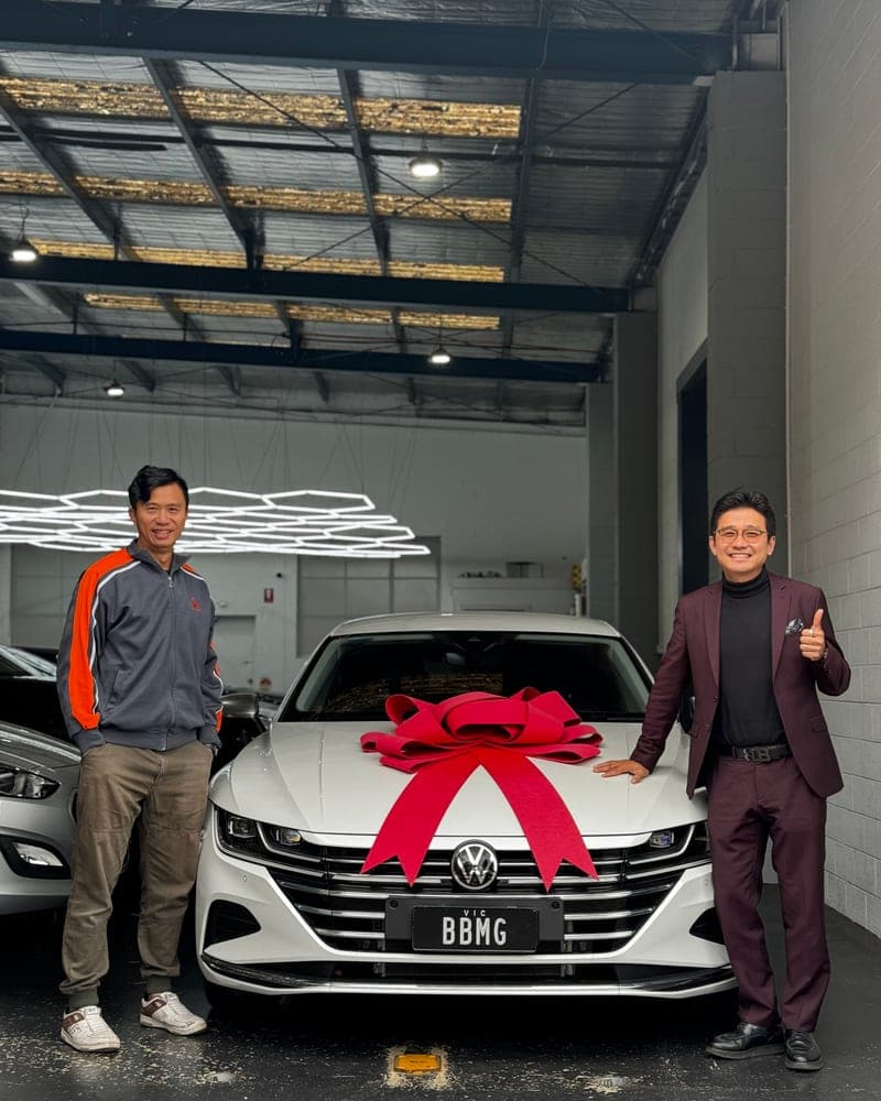 A customer picking up their car at Bayside Brothers Motors