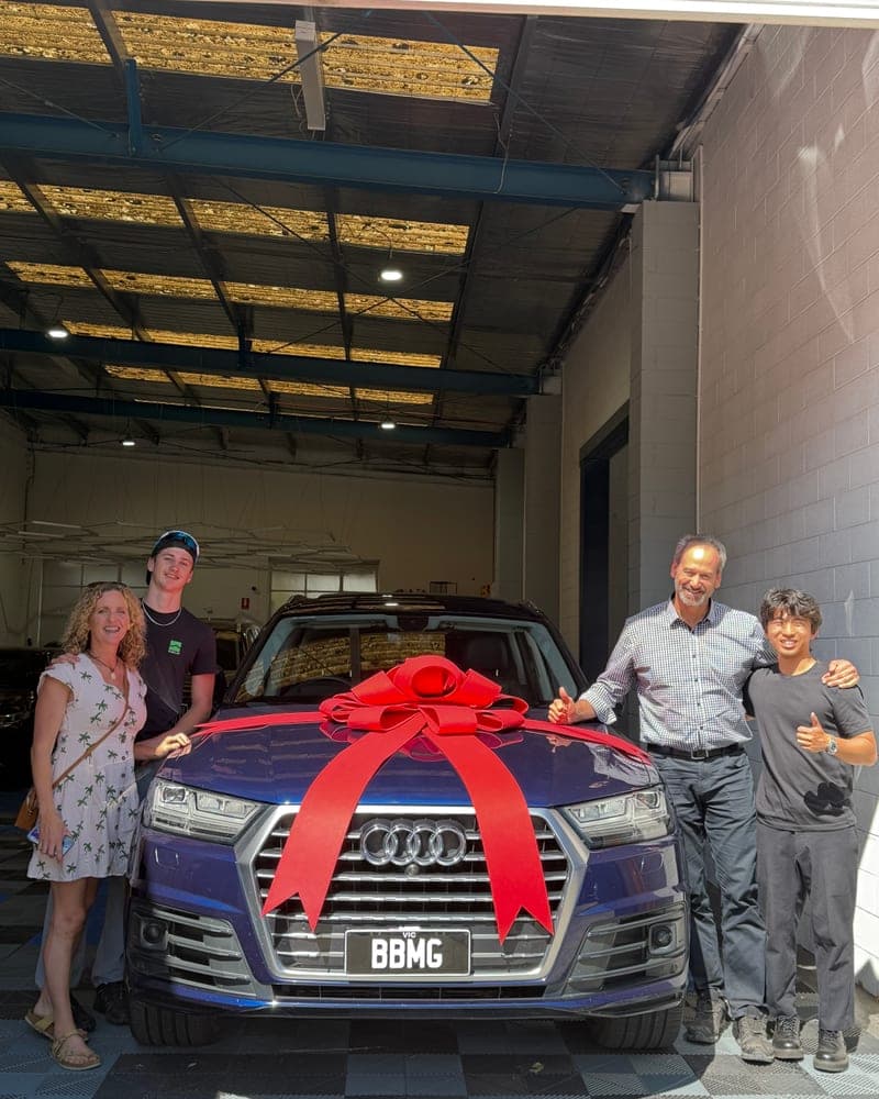 A customer picking up their car at Bayside Brothers Motors