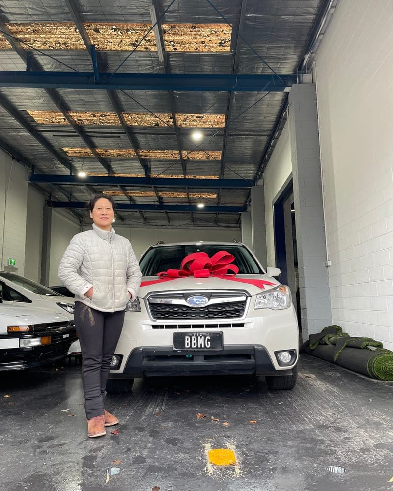 A customer picking up their car at Bayside Brothers Motors