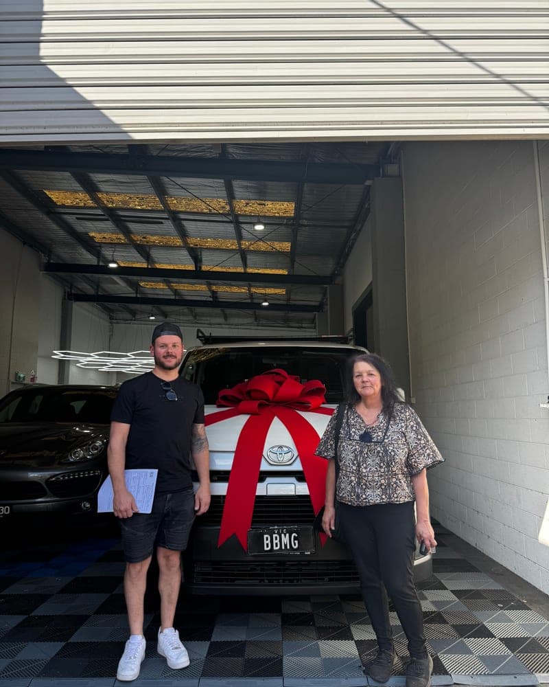 A customer picking up their car at Bayside Brothers Motors