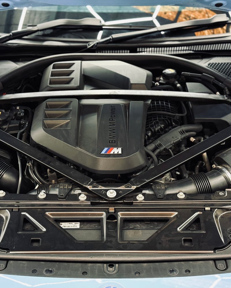 The BMW M Power engine bay of a car sold by Bayside Brothers Motors